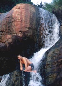 Taking a shower in a waterfall