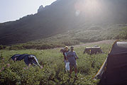 Sun rises over the mountain above the camp